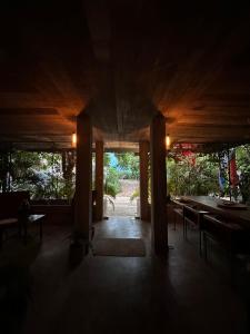 a dark room with a table and chairs in it at AORA San Pancho in San Francisco