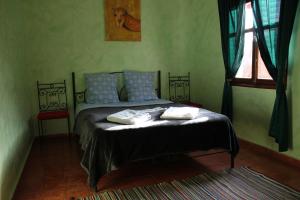 Voodi või voodid majutusasutuse Kasbah lucas toas