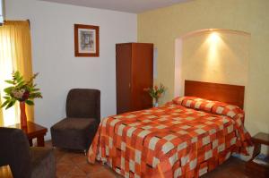 Postel nebo postele na pokoji v ubytování Hotel La Rienda Mision Tequillan