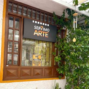 a store window with a sign that says step into aire at HOSTAL SEP7IMO ARTE in Bogotá