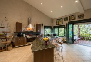 a large kitchen with a island in the middle at Mont Carpe Diem 