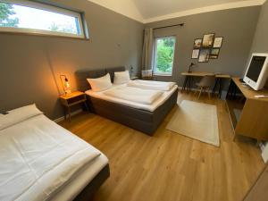 Katil atau katil-katil dalam bilik di Ferienhaus WICA