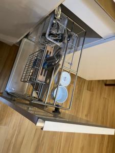 a dishwasher in a kitchen with dishes in it at Aesthetic Functional Minimalist Space Sunvida Tower SV1716 in Cebu City