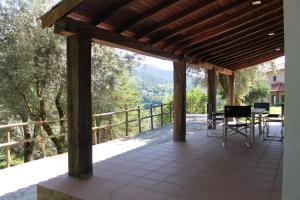 a view from the porch of a house with a table and chairs at Casas do Corvo in Ventosa