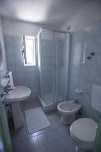 a bathroom with a toilet a sink and a shower at Albergo Marina in Sestri Levante