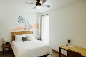 a bedroom with a bed and a ceiling fan at Big Mountain At Switchback Suites in Kalispell
