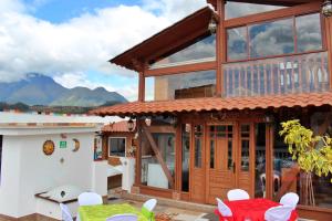 a house with a view of the mountains at Chaska Hotel in Otavalo