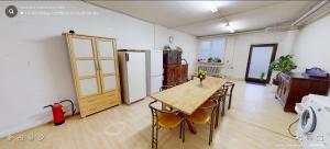a room with a table and chairs and a refrigerator at Monteurunterkunft Haus Onsti in Albstadt