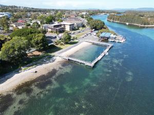 an aerial view of a dock in a body of water at Wallis View 13 in Forster