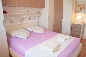 Łóżko lub łóżka w pokoju w obiekcie Apartment Luna & Lea