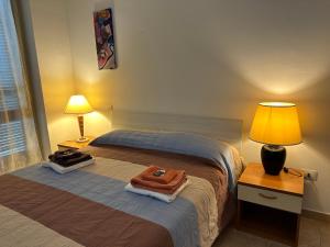 Postel nebo postele na pokoji v ubytování Casa vacanze Giuliani via Rasiglia