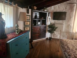 a bedroom with a blue dresser and a bed at Casa Palmera in Tacoronte