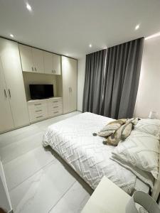 Postel nebo postele na pokoji v ubytování Modern & Cosy Apartment in Marsaxlokk