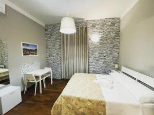 מיטה או מיטות בחדר ב-Rooms & Breakfast La Filigrana