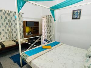 a bedroom with a bunk bed and a desk at Atithya in Udaipur