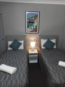 Solomon Inn Motel Figtree客房内的一张或多张床位
