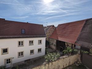 an aerial view of two buildings with roofs at Wohnen am Main 1a-ammain in Margetshöchheim +4 photos