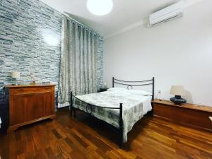 Postel nebo postele na pokoji v ubytování Rooms & Breakfast La Filigrana
