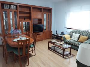 a living room with a table and a couch at Celia in Redondela