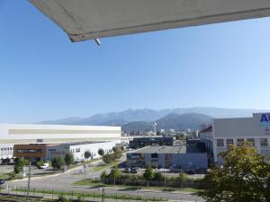 a view of a city with mountains in the background at superbe duplex avec parking gratuit in Grenoble
