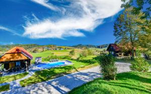 an estate with a swimming pool and a house at Holiday Home BIBA With Heated Outdoor Pool in Gornja Stubica