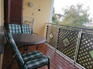 a balcony with a table and chairs and a view at Haus Hochwald in Rottweil