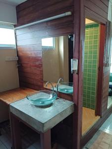 a bathroom with a sink and a mirror at Nearthepark Backpack Hostel 2 in Chiang Mai