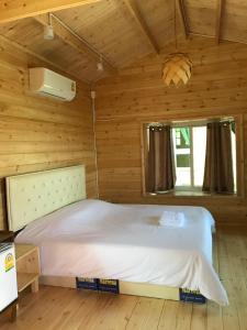 Postel nebo postele na pokoji v ubytování Sripiamsuk Resort Bangkok