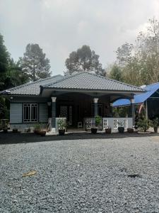 a house on the side of the road at Cp homestay in Batu Kurau