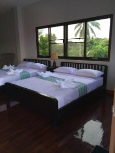 Postel nebo postele na pokoji v ubytování Sripiamsuk Resort Bangkok
