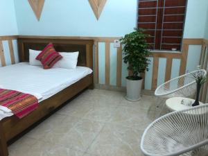 מיטה או מיטות בחדר ב-Homestay Hải Long