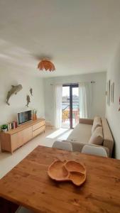 a living room with a couch and a table at El Cotillo On The Beach Playa La Concha Sea view in Cotillo