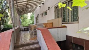 a balcony of a building with a table and chairs at Flava Hostel in Cluj-Napoca