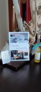 a table with two cards on top of a laptop at SOLE e MARE Luxury Home in San Salvo