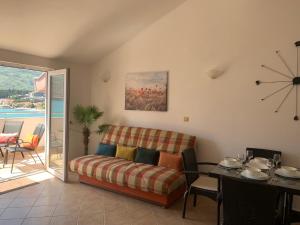 a living room with a couch and a table at Daniel in Igalo