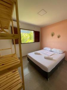 a bedroom with a bunk bed and a ladder at Casa Valentina em Milagres - AL in São Miguel dos Milagres