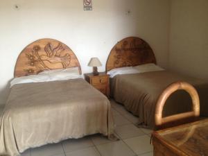 Cama o camas de una habitación en Hotel Colibri Queretaro