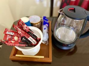 a counter with a blender and a bowl of candy at The Good choice 