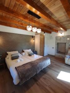 a large bedroom with a large bed and lights at 27A01 Casa Uría - Cam. Santiago in Berducedo