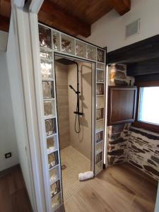 a walk in shower with a glass door in a room at 27A01 Casa Uría - Cam. Santiago in Berducedo