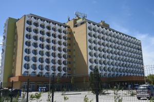 a building with many windows on the side of it at Top Sunset Beach Apartman in Siófok