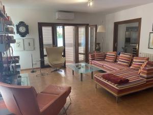 a living room with a couch and a glass table at Mojacar Villa - Villa Caletta - 4 bedroom - sleeps 8 - R954 in Mojácar