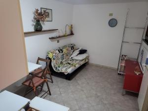 a living room with a couch and a table at Barbara rooms in Foligno