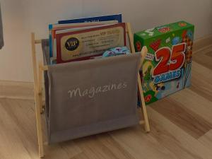 a chair with books on it next to a box at Studio TERJANO in Karpacz