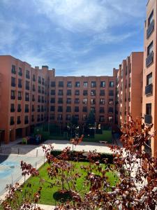 a large building with a courtyard in front of it at Samaniego suite, AirPort, ifema turístico in Madrid