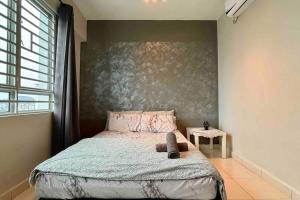 a bedroom with a bed with a stuffed animal on it at Moderm Spacious 6pax S PICE Penang in Bayan Lepas