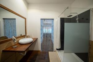 a bathroom with a sink and a shower at Beachfront Villa Patti ZanzibarHouses in Kiwengwa