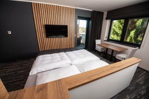 Ένα ή περισσότερα κρεβάτια σε δωμάτιο στο Hotel Kras