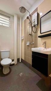 a bathroom with a toilet and a sink at 'A'ffordable Spacious 6pax S PICE Penang in Bayan Lepas