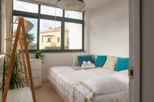 a bedroom with a bed and a large window at Villa Turquesa Estoril in Alcabideche +60 photos